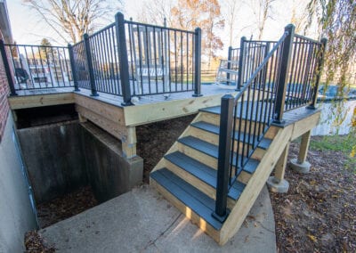 Black Wood stairs with iron fenced Deck Modeling