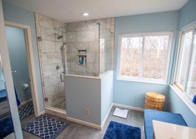 Aqua colored and Marble Tiles in Standing Bathroom